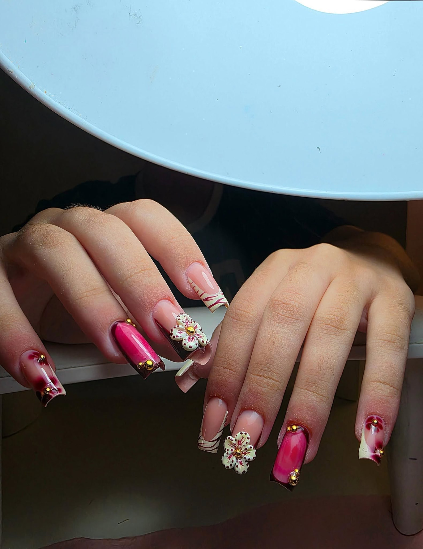 Pink and cream nails with 3D floral detail and gold beads