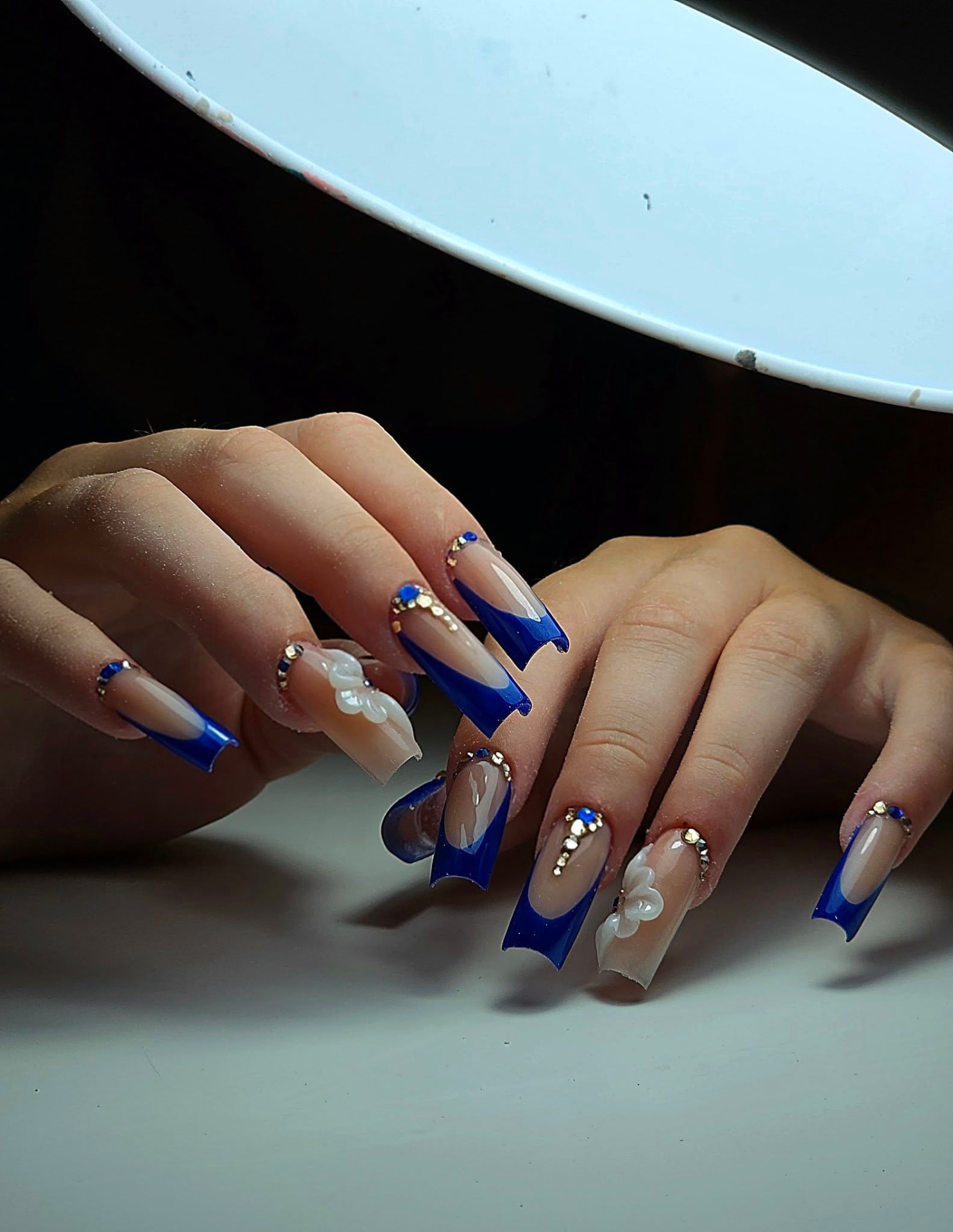 Royal blue French tips with crystals and 3D flowers
