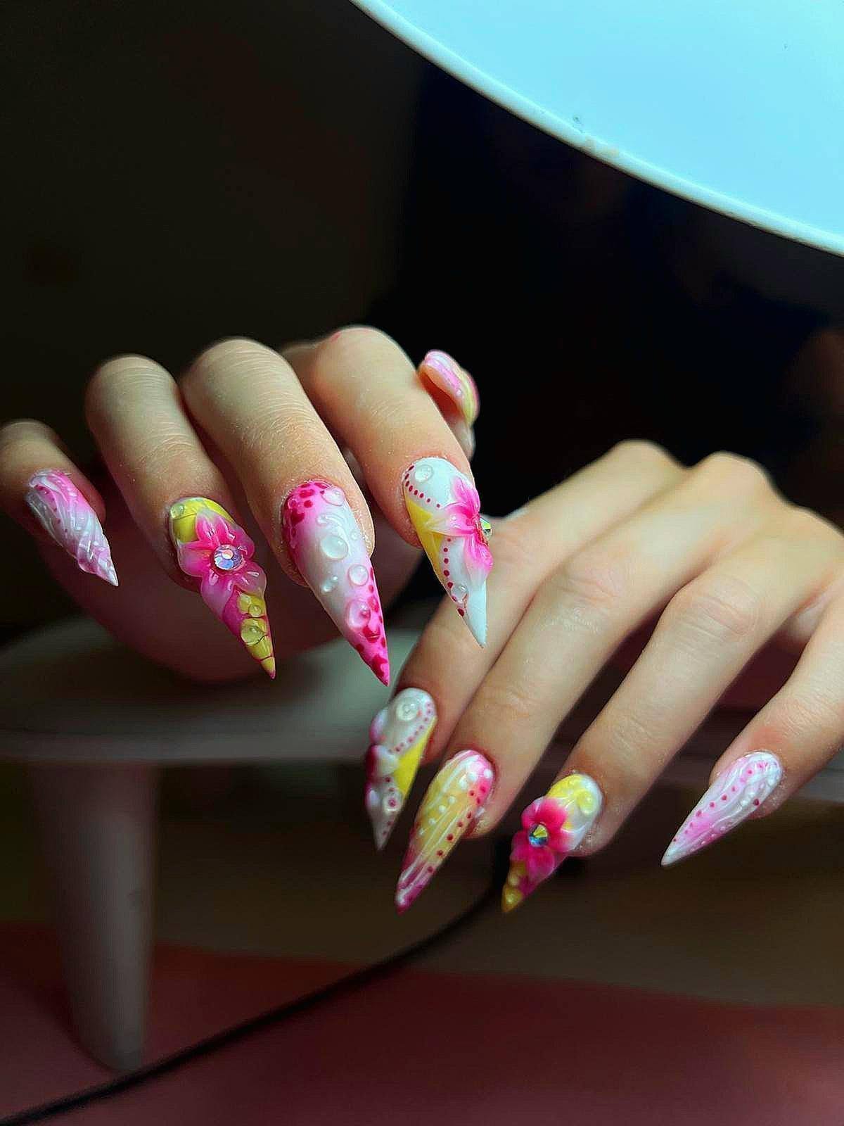 Pink and yellow hand-painted floral stiletto nails